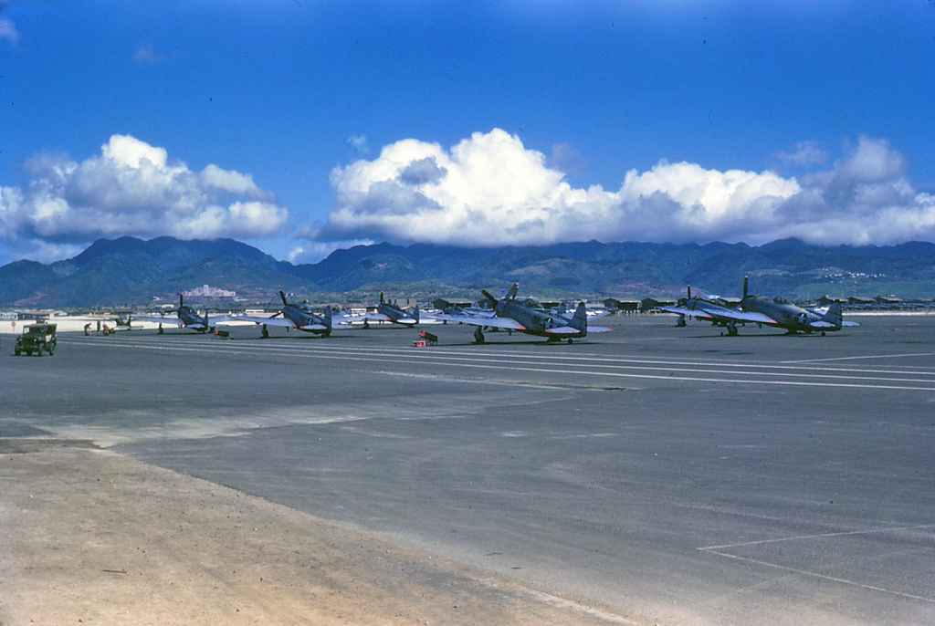 Very historic image of USAF P-47D Thunderbolts lined up on the Hickam AFB apron taken during post World War II in the late 1940s. Glorious kodachrome.