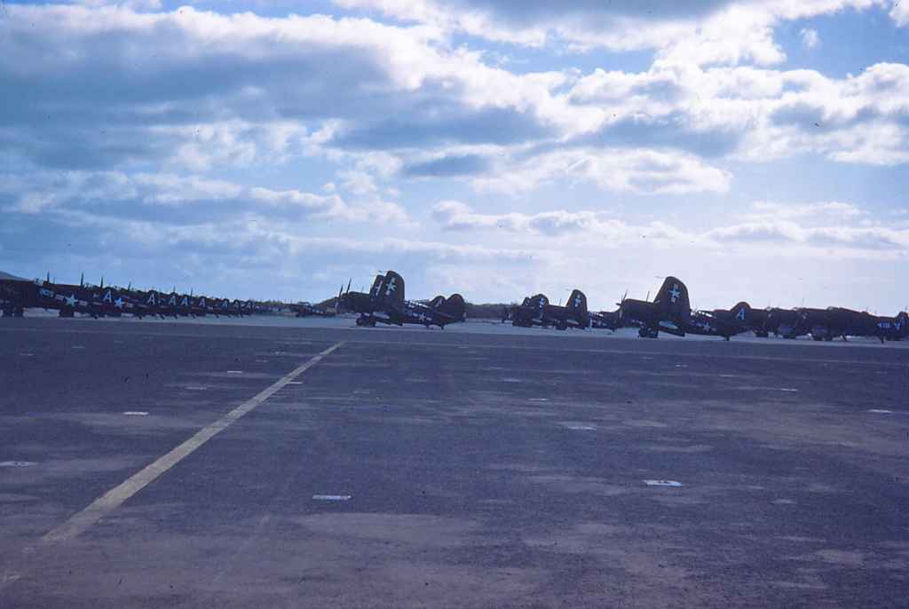 A very busy and well protected Hickam apron, circa mid to late 1940s. We have rows of Curtiss Sb2 Helldivers, as well as Corsair IIs.