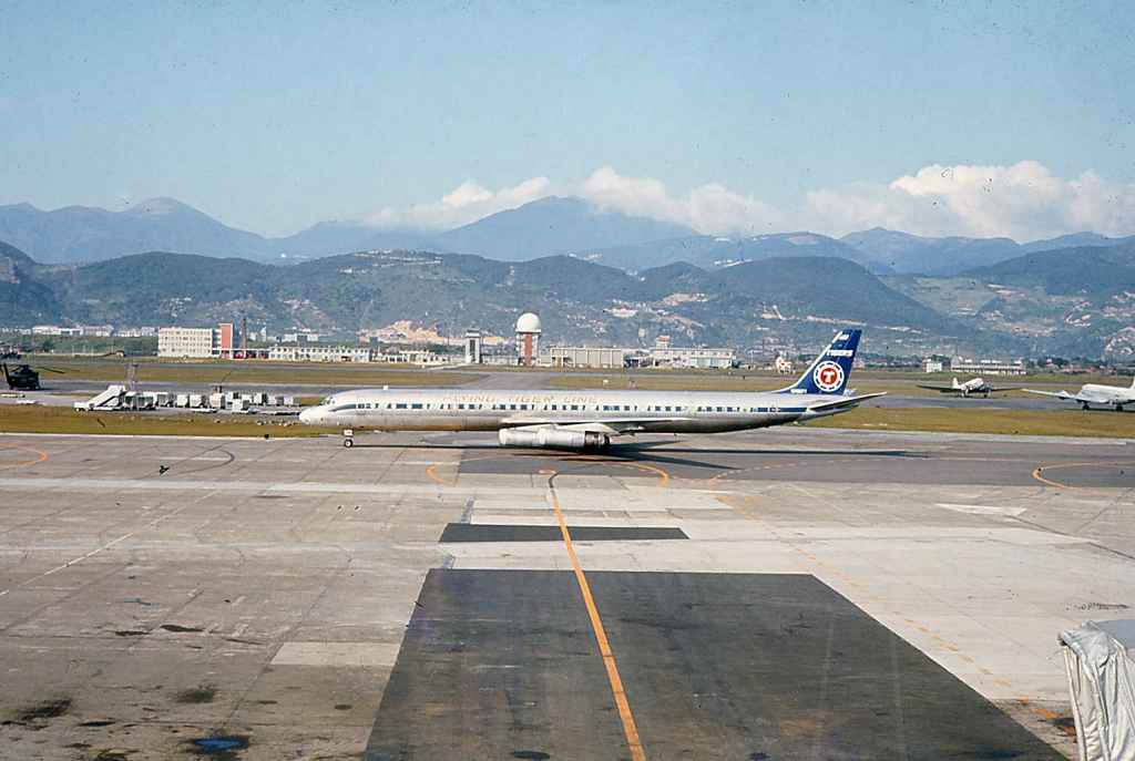 Flying Tigers DC-8-63 mid apron at Taipei Sung Shan airport circa 1971.