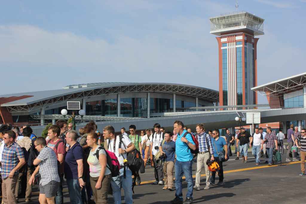First ever tourists arrive and await tourist busses at new Wonsan Airport DPRK North Korea Sep 24, 2015