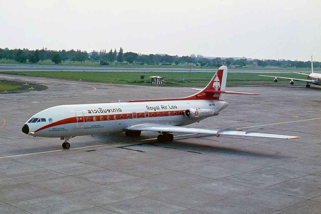 Royal Air Lao Caravelle XW-PNH taxiing at at Bangkok 1975. Photo by Ron Kosys.