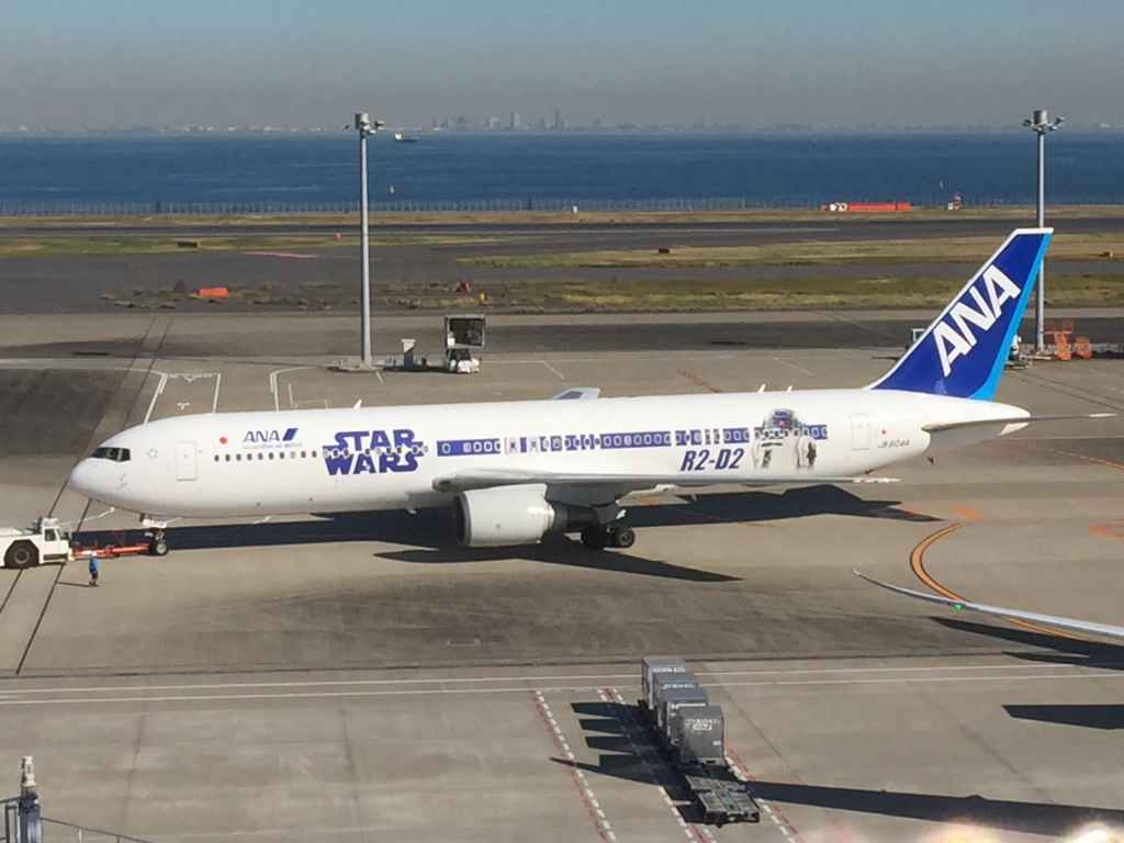 ANA Star Wars 767 at the obsdeck at Tokyo Haneda ANA Terminal 2 with Tokyo Bay in the background