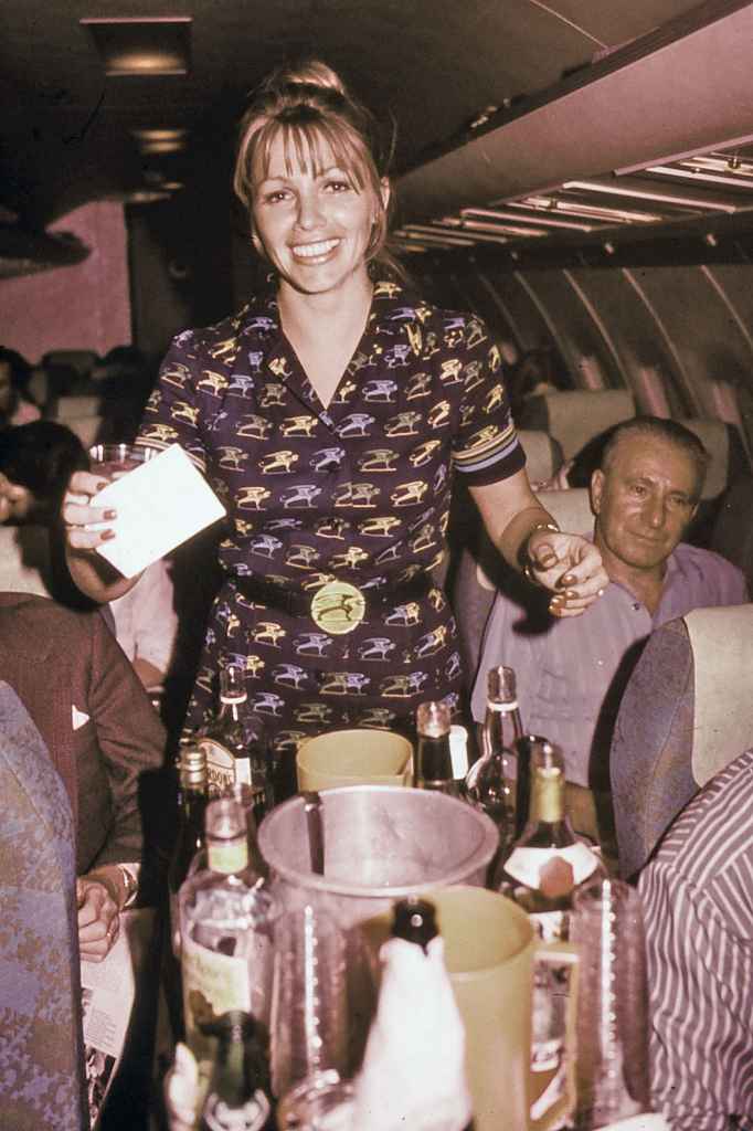 Flight attendant and cocktail service aboard Bavaria BAC One Eleven Fun Jet circa early 1970s.