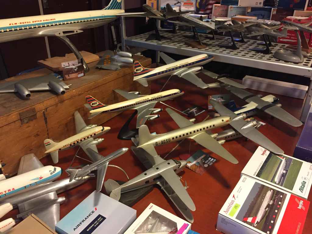 Big Raise Up KLM 1/50 DC-8 at top, with Verkulyl Martinair DC-8 1/100 in metal, a 1/50 Martinair Convair 640 in resin and an assortment of refinished wooden ID models, all offered for sale at the Amsterdam Aviation Fair 2019.