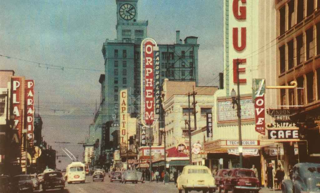 Granville Street Vancouver BC circa 1954. Photo was taken looking north in the heart of the city's theatre district with numerous neon signs. This street is the main street of Vancouver and extends from West 70th near the airport, all the way to the wharf, a length of 10 miles. (Colour photo courtesy of Canadian Pacific Railway, post card published by Vancouver Magazine Services LTD.)