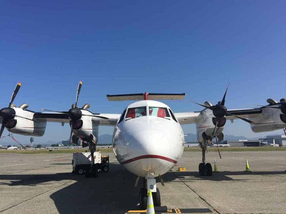 The Dash-7 is a special purpose 1970s era STOL aircraft designed for passenger and cargo operations from short gravel strips, with obstacles on both ends of the runway. This nose view shows the rugged gear and ample prop to ground clearance for gravel ops.