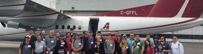The Dash-7 STOL Experience With Air Tindi Between Vancouver and Abbotsford All the charter participants posed for a group photo with our Air Tindi Dash-7 before our early morning departure from YVR to the Abbotsford airshow.
