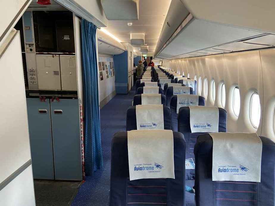 Interior main deck cabin view of KLM 747-300 PH-BUK at Aviodrome, Netherlands.