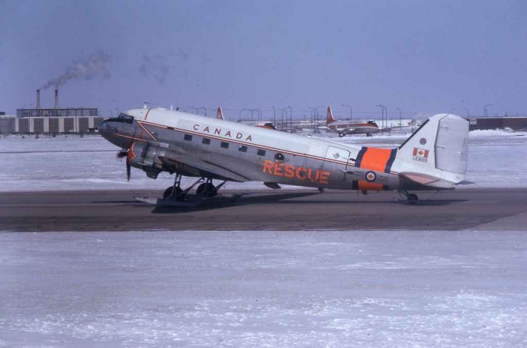 Canadian Armed Forces Training Rescue C-47 Dakota 12905 at Winnipeg in April of 1974. Notice recently retired Air Canada Viscounts that are parked in the background.