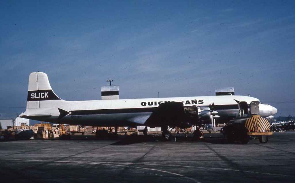 SLICK Airways QUICKTRANS DC-6 N91309 circa early 1960s at location unknown.