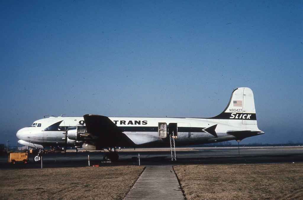 SLICK Airways QUICKTRANS DC-4 C-54 N90427 circa late 1950s or early 1960s.