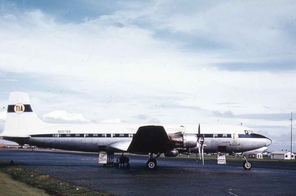 Trans International DC-6 N90768 possibly at Prestwick circa early 1960s.