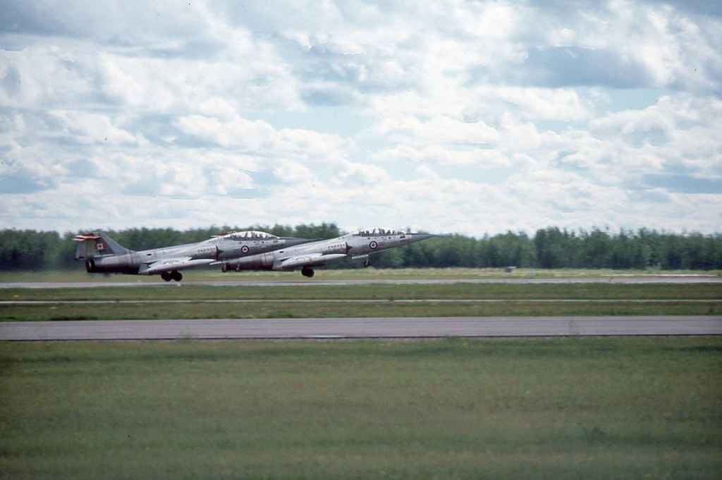 Canadian Armed Force CF104 Starfighters 2 ship scramble at CFB Cold Lake July 1977.