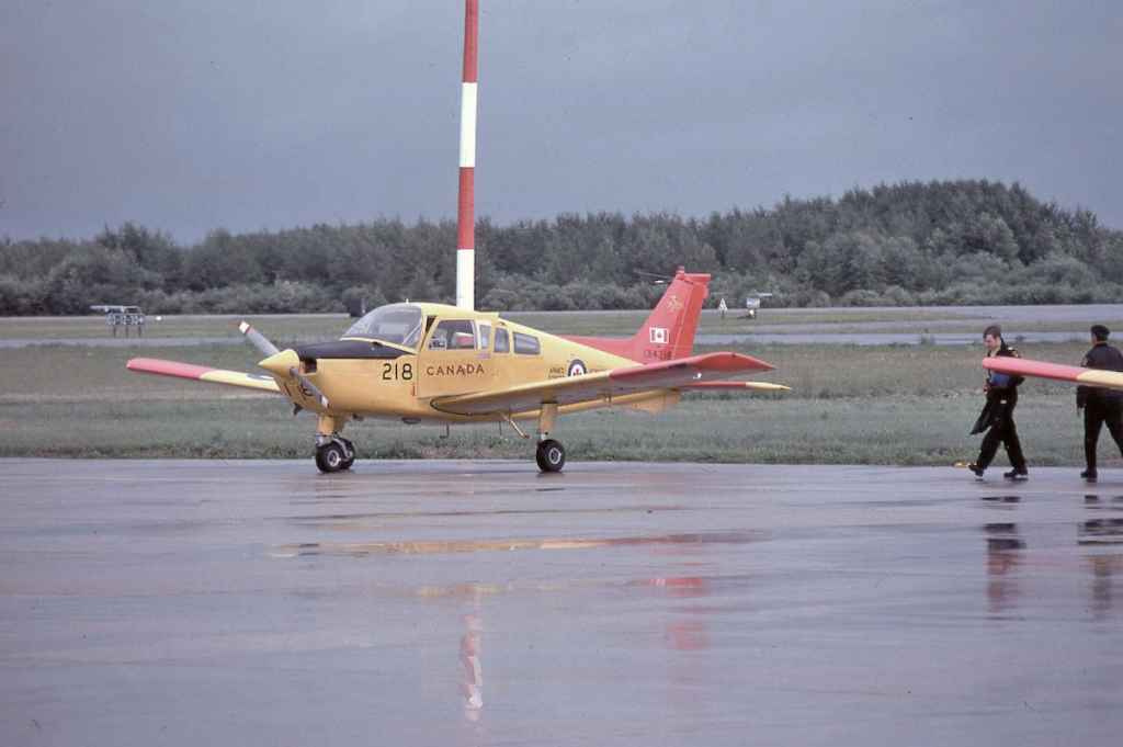 Canadian Armed Forces Beech Muskateer 134218 with student pilots at CFB Moose Jaw July 1977.