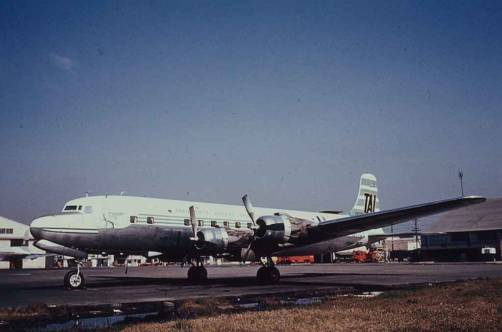 TAI Transports Aeriens Intercontinentaux DC-6 reg not visible seen at Tokyo Haneda circa early 1960s.