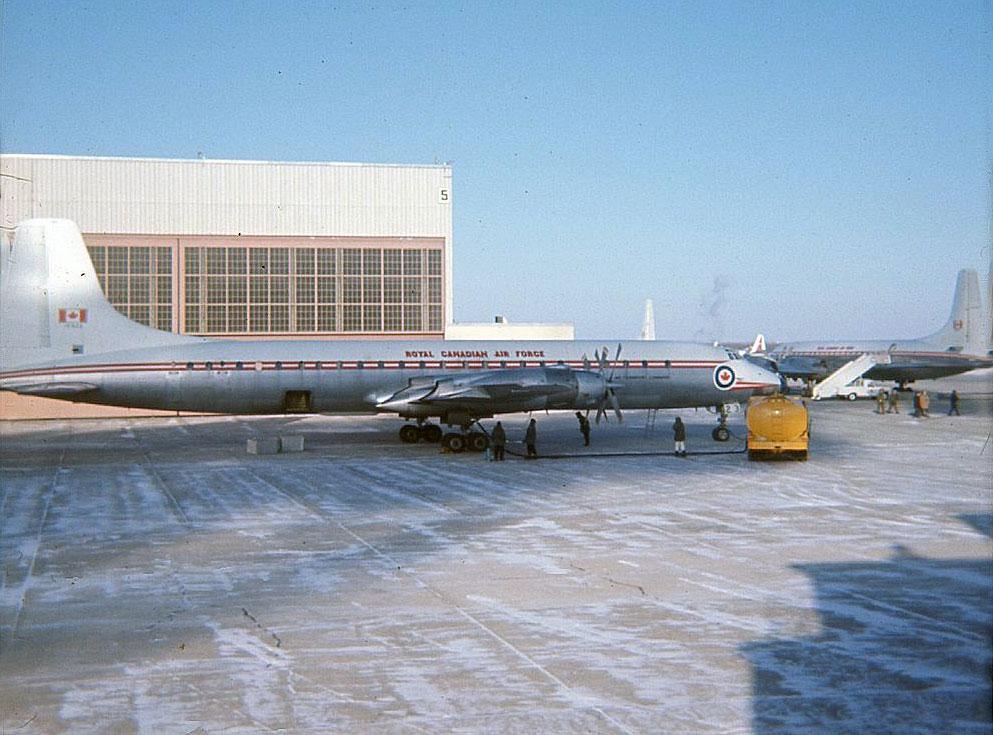 RCAF Royal Canadian Air Force Canadair CL-44 Yukon 15923 at CFB Namao with another Yukon winter 1967.