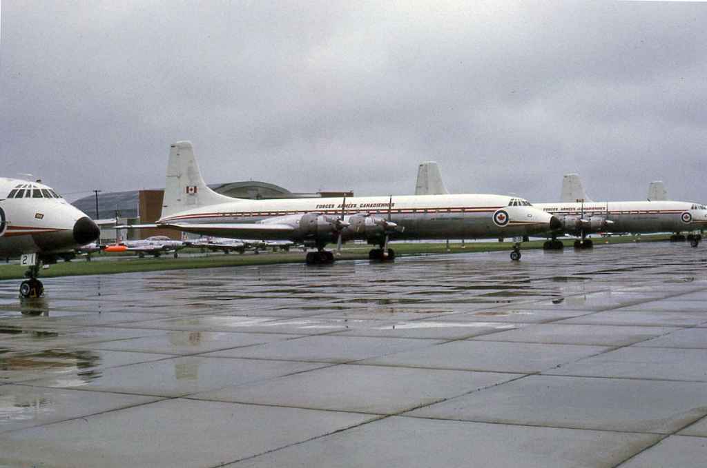 Fabulous RCAF Canadair Yukon line up shot. RCAF Royal Canadian Air Force Canadair CL-44 Yukon 106929 centre frame in storage at Saskatoon July 1971. The entire Canadian Forces Yukon was placed into storage at Saskatoon when the Boeing 707 fleet went into service in 1970-1971.