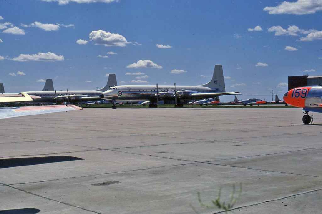 Fabulous RCAF Canadair Yukon line up shot. RCAF Royal Canadian Air Force Canadair CL-44 Yukon 106932 centre frame in storage at Saskatoon July 1971. The entire Canadian Forces Yukon was placed into storage at Saskatoon when the Boeing 707 fleet went into service in 1970-1971.