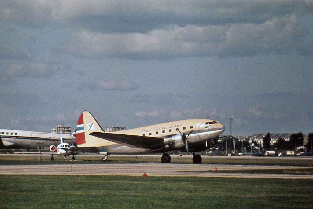 Fred Olsen Lines C-46 Commando reg not visible location not known, circa 1960s.